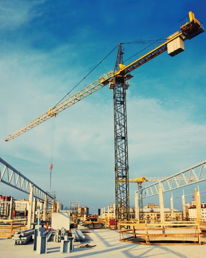 Haztek Inc. - Safety management site featuring crane poised above an assortment of construction materials.