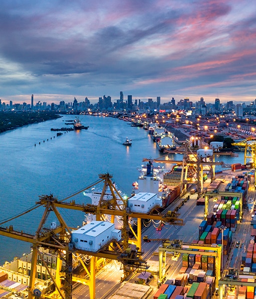 Haztek Safety Management - A stunning landscape of waterfront construction projects under a multicolored sky.