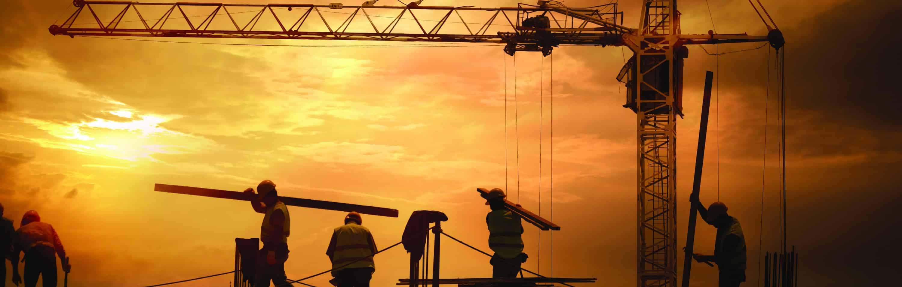 Construction Site HazTek Diversity Statement: United in Safety - Four site safety managers from diverse nationalities pose with arms crossed, exemplifying HazTek's commitment to inclusivity and safety.